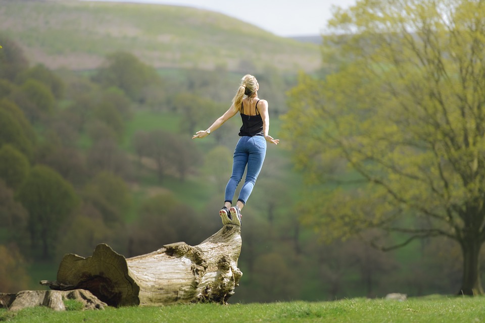 ZenWillow girl balancing on log